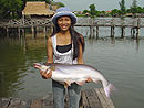 Girl With Striped Catfish.