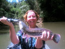 Lady with Giant Snakehead.