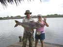 Girl With Striped Catfish.